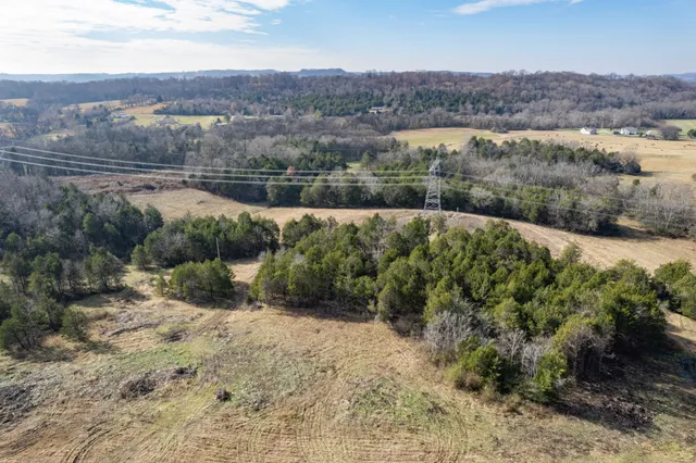 an aerial view of mountain with lake view