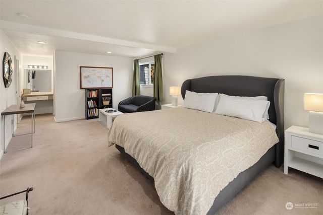 a bedroom with a bed and lamp