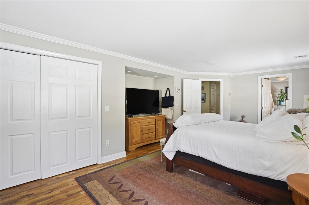 9 Kanehoe Court Townsend, MA 01474 - Photo 14 of 31 a bedroom with a bed and a flat screen tv