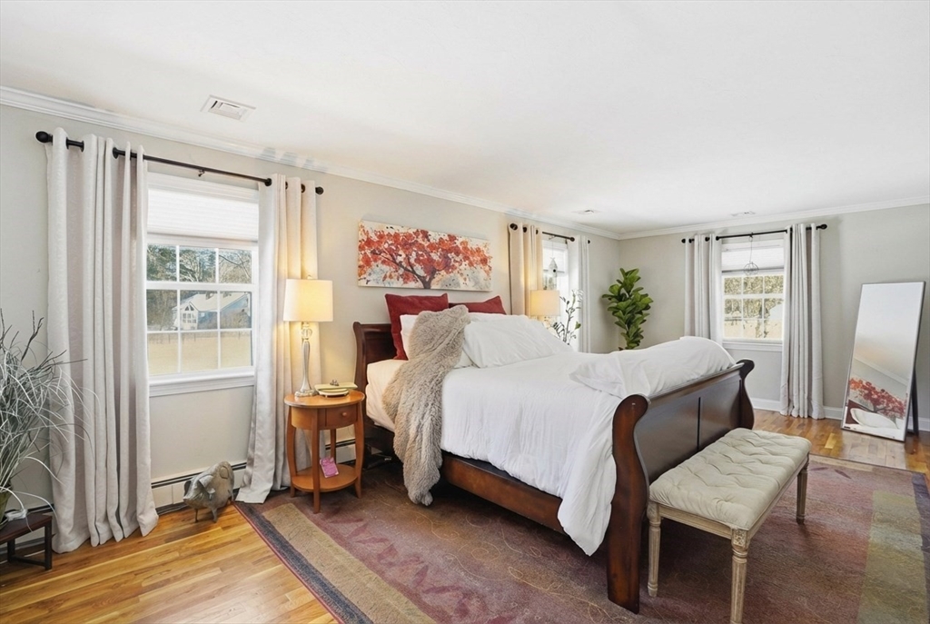 9 Kanehoe Court Townsend, MA 01474 - Photo 15 of 31 a bedroom with a bed wooden floor and window