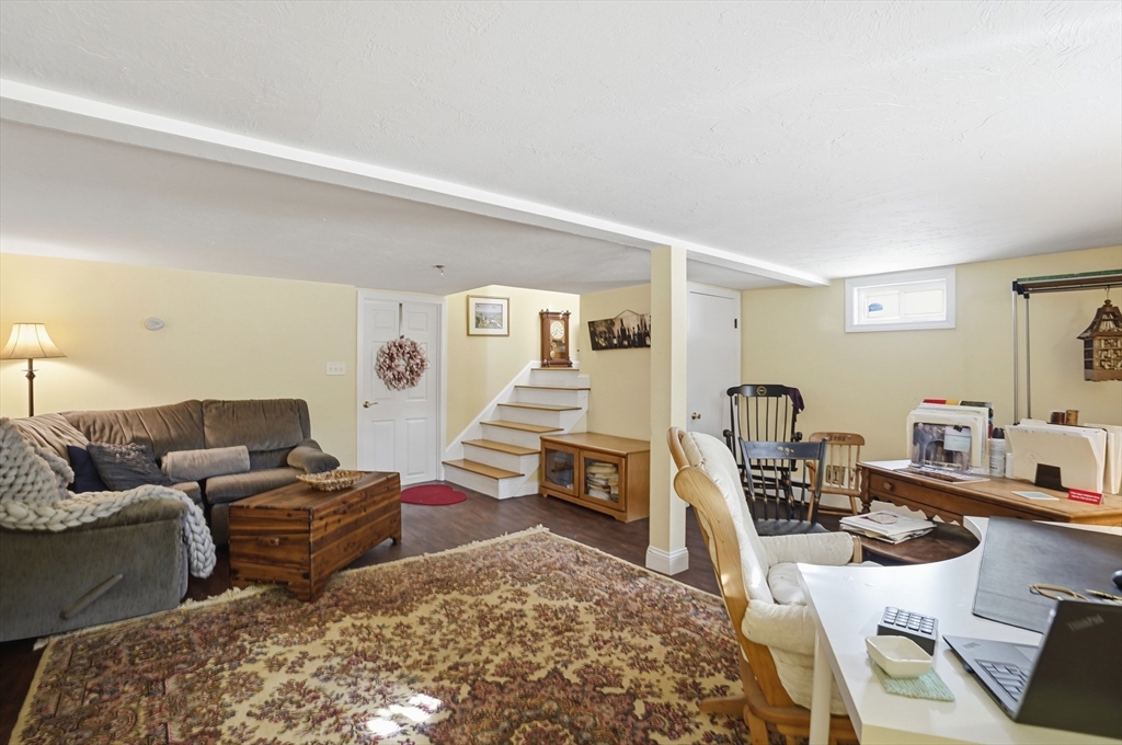 9 Kanehoe Court Townsend, MA 01474 - Photo 22 of 31 a living room with furniture and a wooden floor
