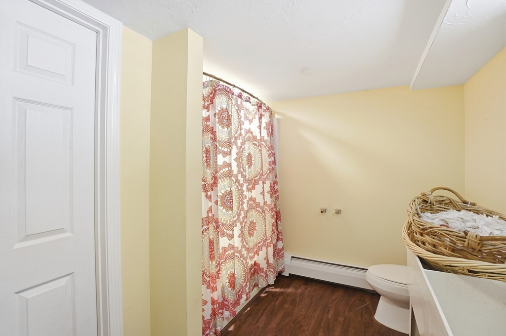 9 Kanehoe Court Townsend, MA 01474 - Photo 24 of 31 a bathroom with a sink a toilet and shower curtain