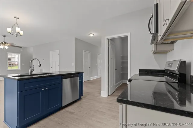 a kitchen with a sink and a window