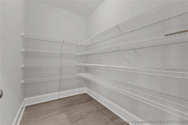 a kitchen with stainless steel appliances granite countertop a stove a microwave a sink and cabinets