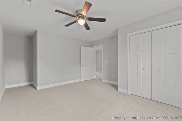 a view of an empty room and a window