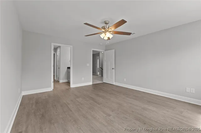 a bathroom with double sink and a mirror