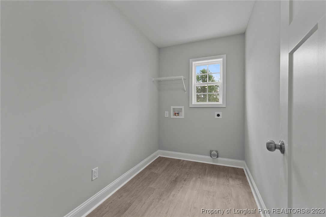 533 Stadium Drive Cameron, NC 28326 - Photo 29 of 42 a view of a small space with wooden floor and a window