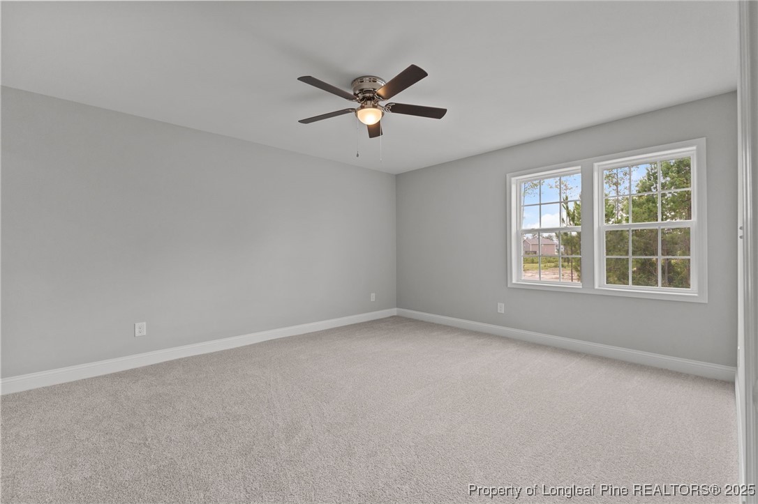 533 Stadium Drive Cameron, NC 28326 - Photo 30 of 42 wooden floor in an empty room with a window