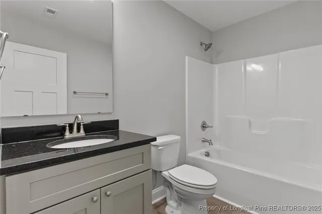 a balcony with wooden floor and fence