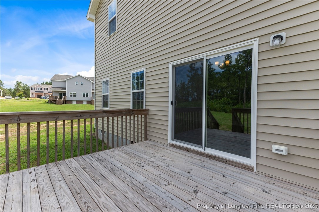 533 Stadium Drive Cameron, NC 28326 - Photo 35 of 42 a view of a wooden deck with a yard