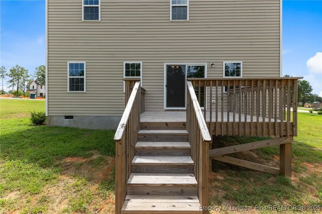 a view of backyard with garden and trees