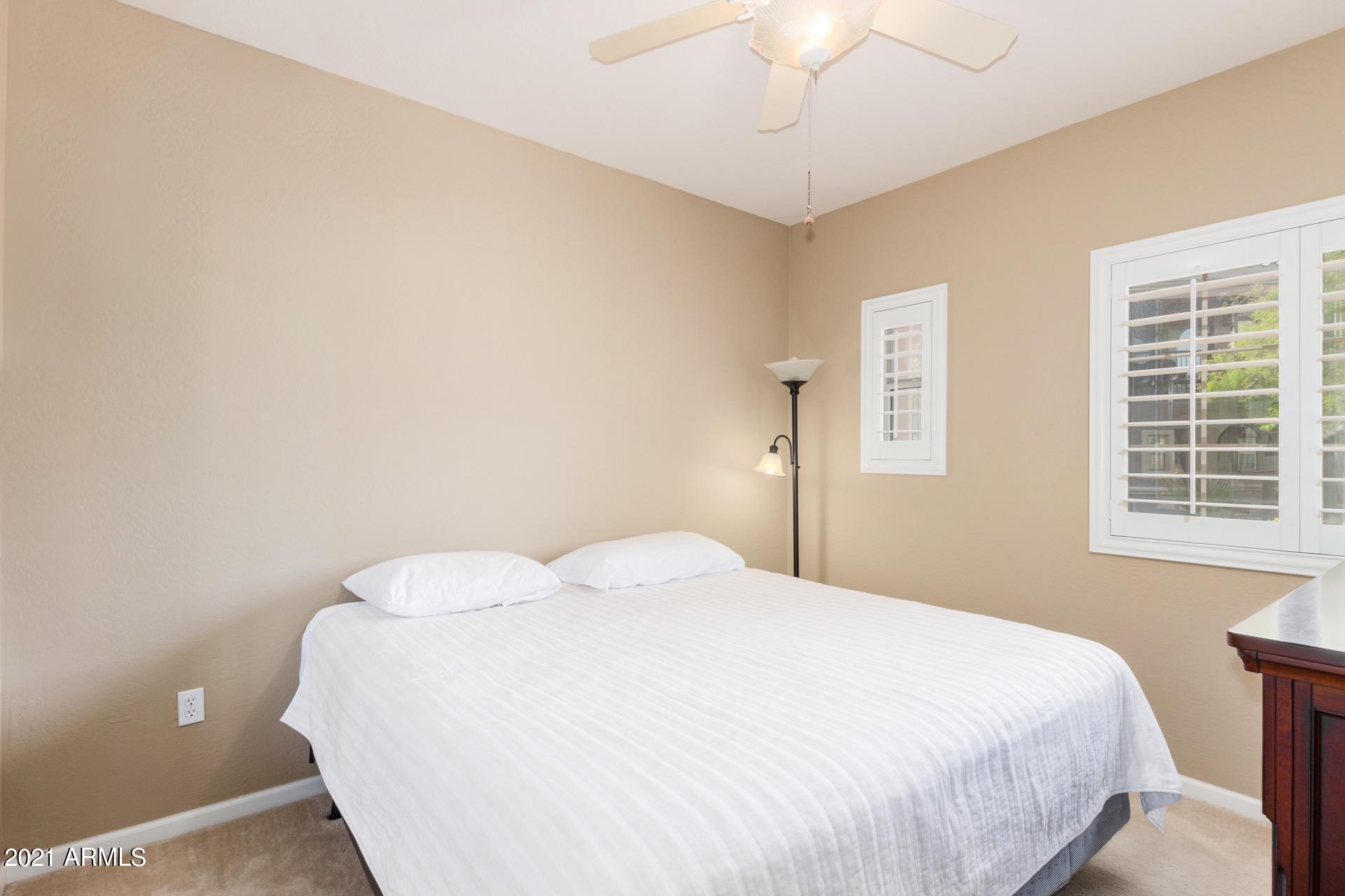 3935 East Rough Rider Road, Unit 1021 Phoenix, AZ 85050 - Photo 21 of 24 Large Second Bedroom