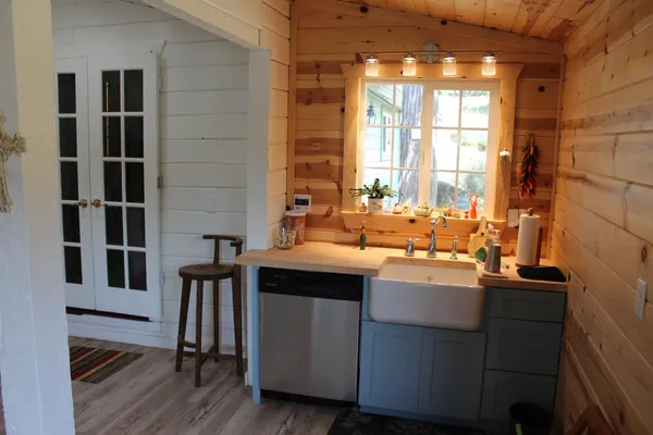 a kitchen with a sink and cabinets