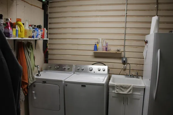 a kitchen with a sink cabinets and window