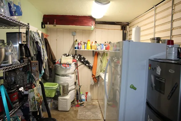 a kitchen with stainless steel appliances granite countertop a sink dishwasher and a stove with wooden floor
