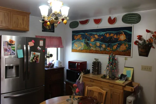 a living room with furniture a rug and a window