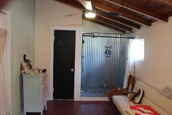 a view of a hallway with seating area