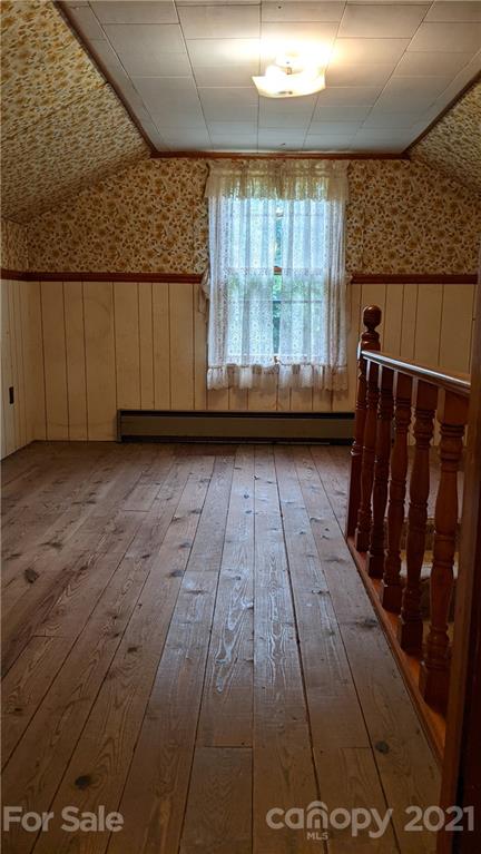 332 Jericho Road Harmony, NC 28634 - Photo 13 of 17 a view of a hardwood floor with a kitchen