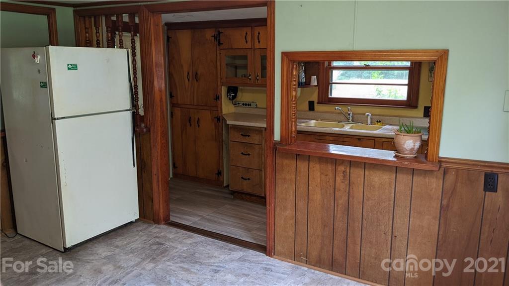 332 Jericho Road Harmony, NC 28634 - Photo 6 of 17 a view of kitchen with stainless steel appliances wooden floor and chair