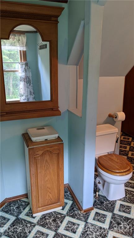 332 Jericho Road Harmony, NC 28634 - Photo 10 of 17 a bathroom with a toilet and a sink