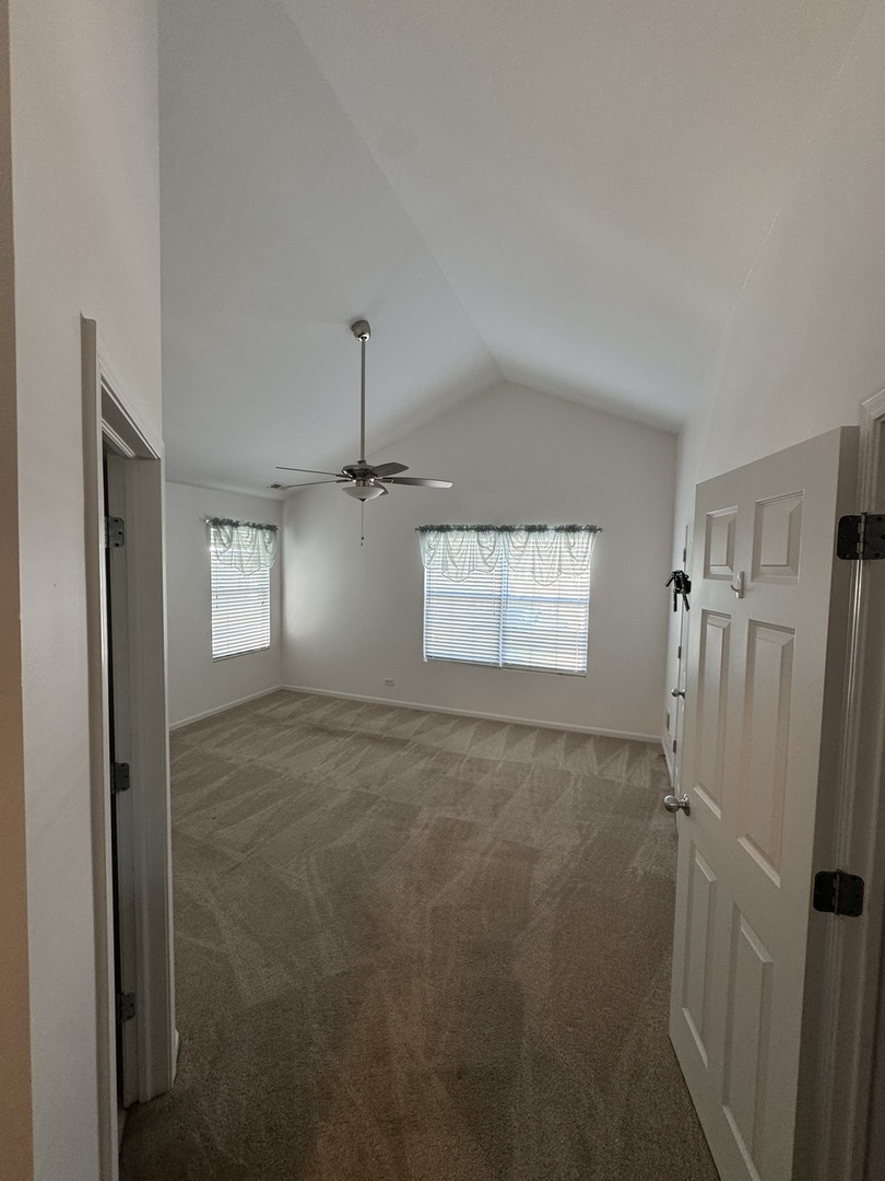 1425 Millbrook Drive Algonquin, IL 60102 - Photo 5 of 11 a view of a hallway with a refrigerator