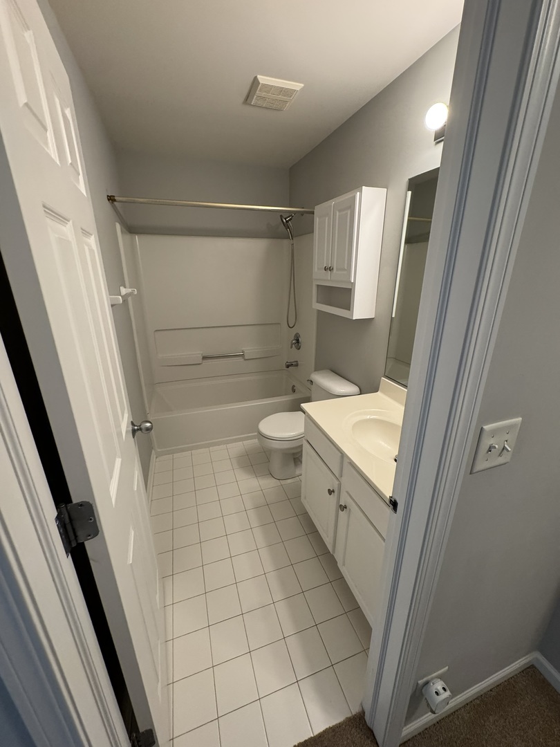 1425 Millbrook Drive Algonquin, IL 60102 - Photo 9 of 11 a bathroom with a sink a toilet and shower