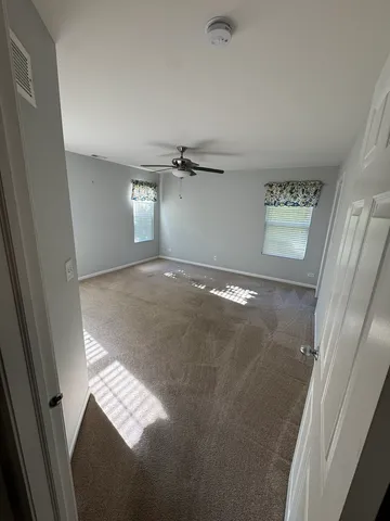 a view of an empty room and window