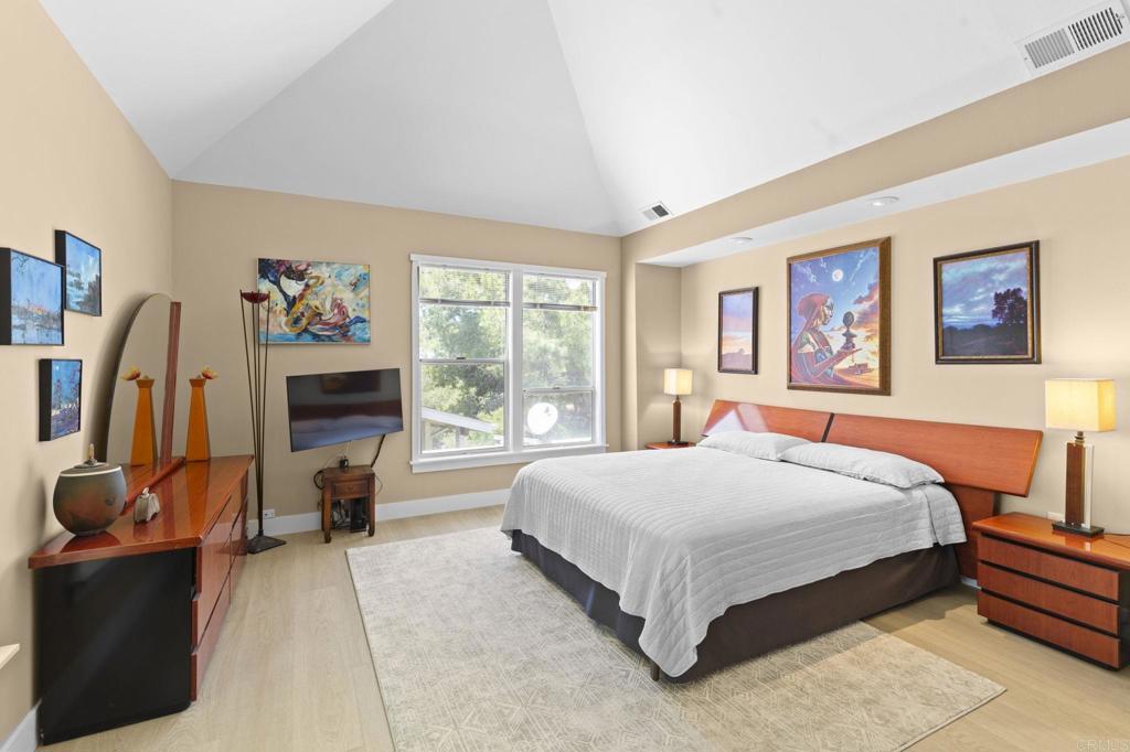 14645 High Valley Road Poway, CA 92064 - Photo 18 of 34 a bedroom with a bed wooden floor and window