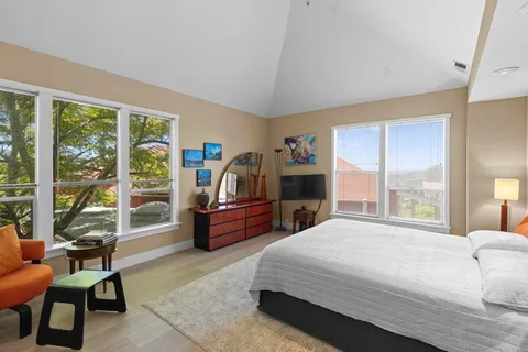 a lobby with furniture and floor to ceiling window