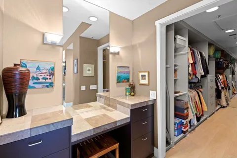 a view of a dining room with furniture and a window