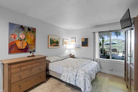 front view of a house with a yard and a garage