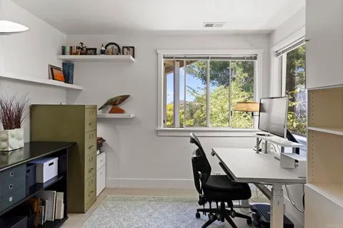 an aerial view of a house with mountain view