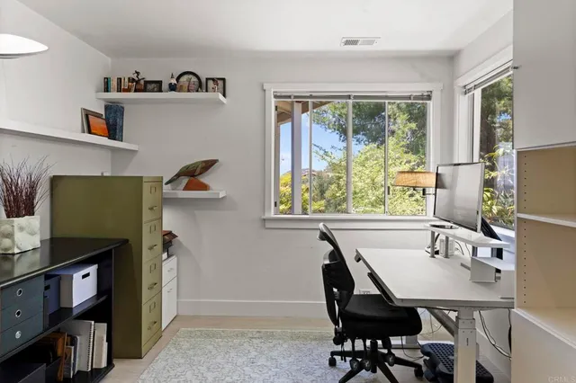 an aerial view of a house with mountain view
