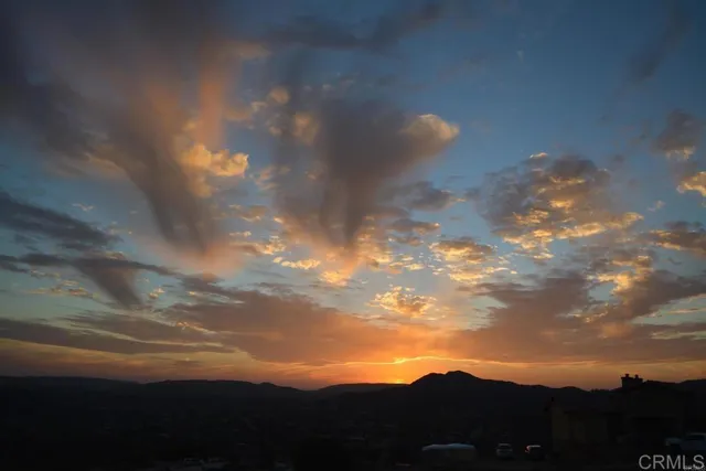a view of a patio with chairs and tables