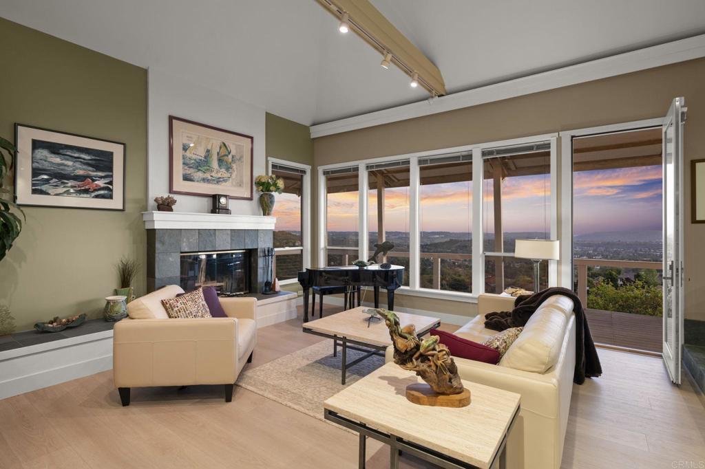 14645 High Valley Road Poway, CA 92064 - Photo 5 of 34 a living room with fireplace furniture and a large window