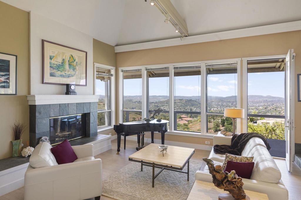 14645 High Valley Road Poway, CA 92064 - Photo 7 of 34 a living room with furniture fireplace and a large window