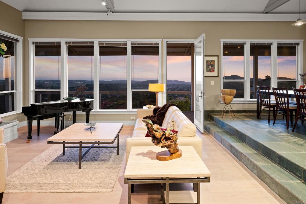 14645 High Valley Road Poway, CA 92064 - Photo 8 of 34 a living room with furniture and floor to ceiling windows