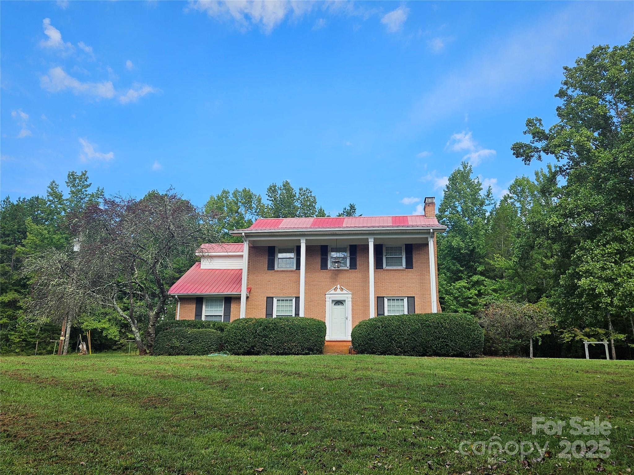 10670 Troutman Road Midland, NC 28107 - Photo 2 of 38 a front view of a house with a yard