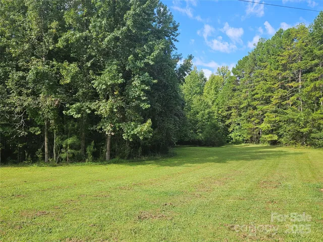 a view of outdoor space with deck and yard
