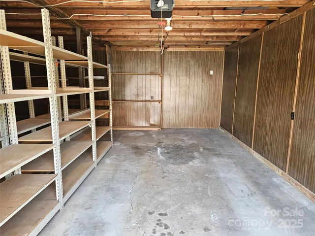 a view of an empty room with a cabinet