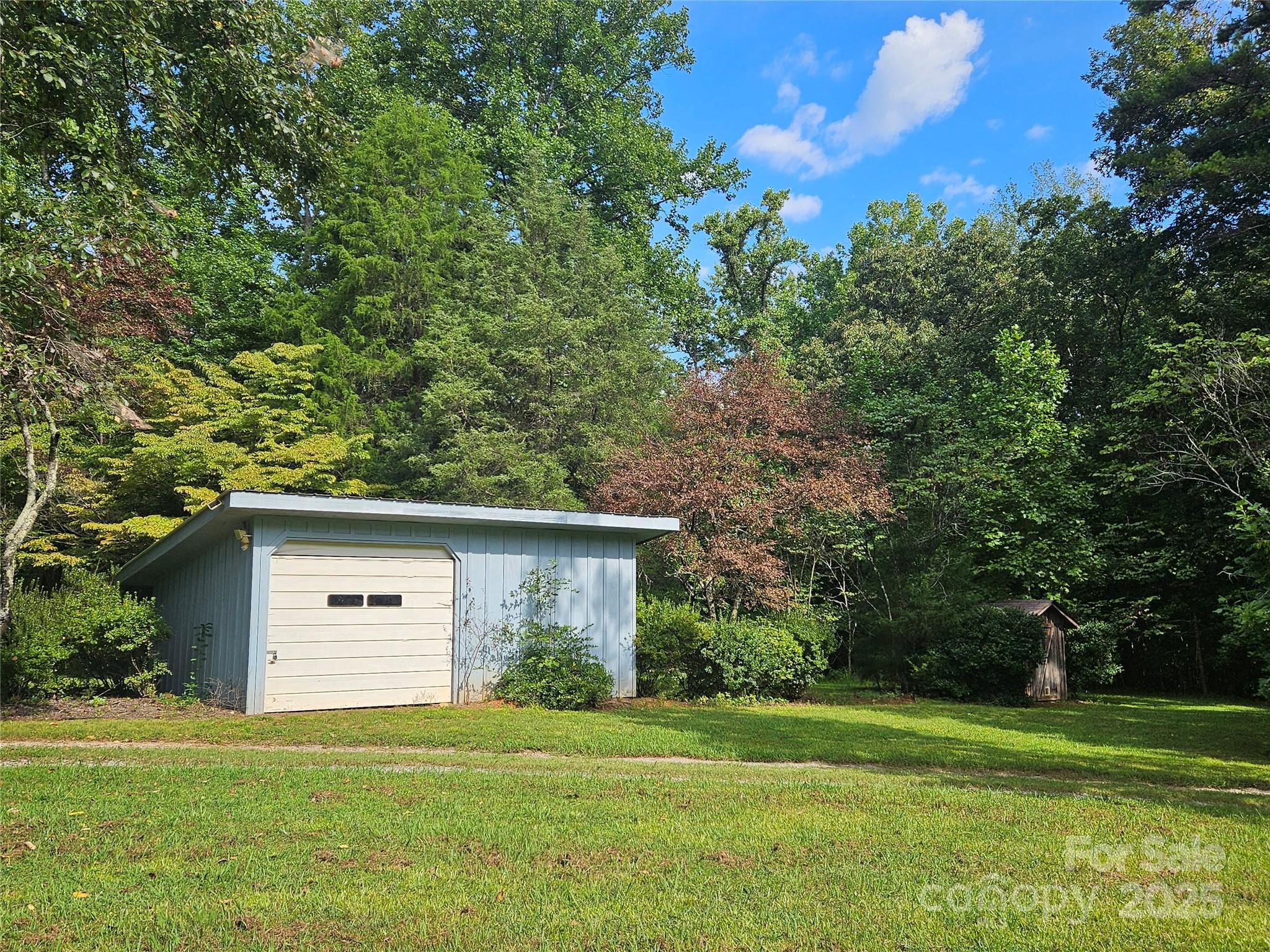 10670 Troutman Road Midland, NC 28107 - Photo 36 of 38 a front view of a house with a yard and trees