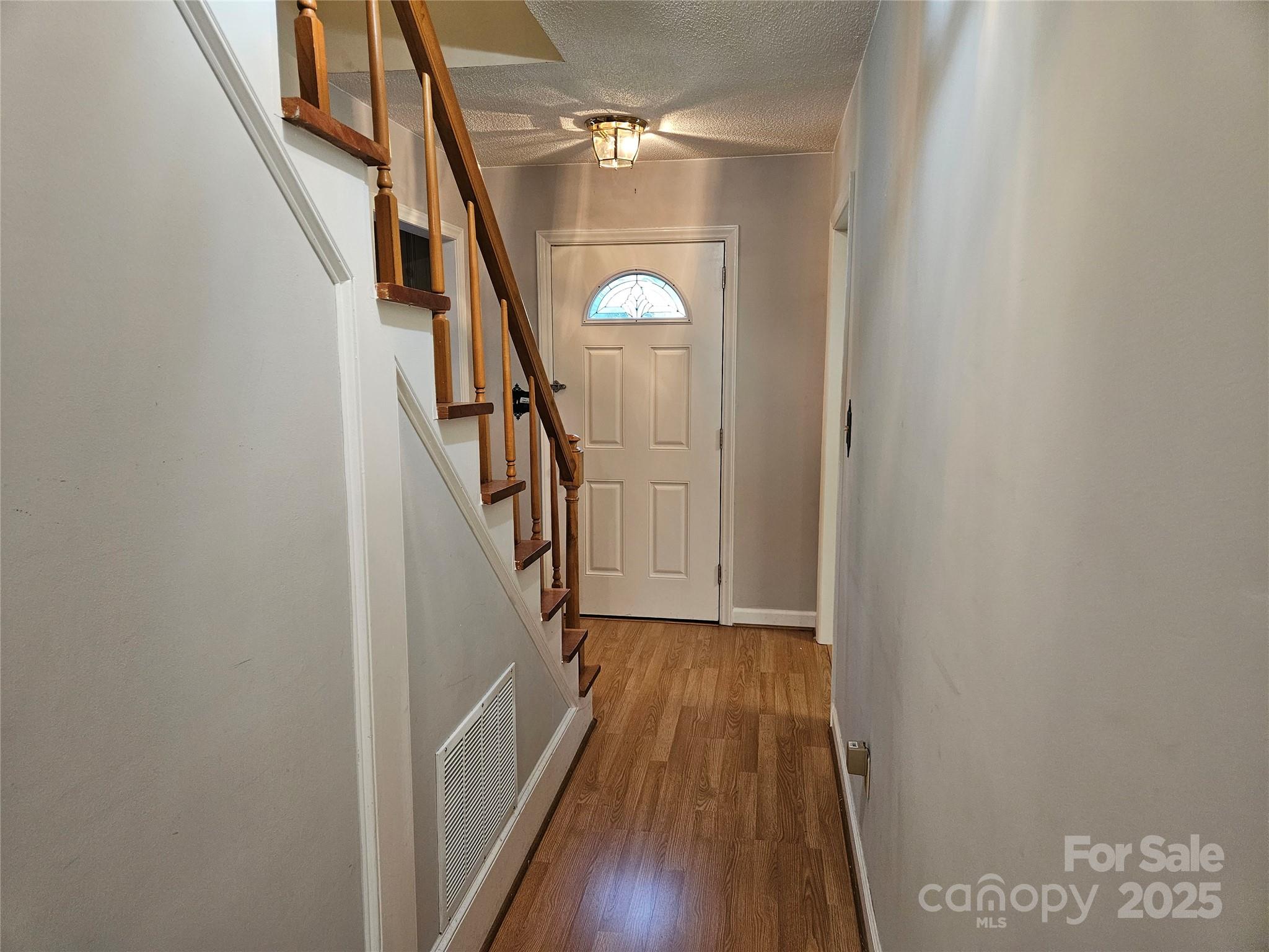 10670 Troutman Road Midland, NC 28107 - Photo 4 of 38 a view of entryway and hall with wooden floor