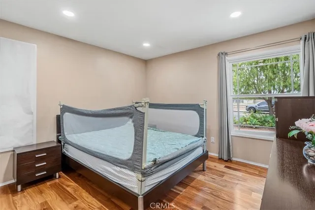 a bedroom with a bed and window