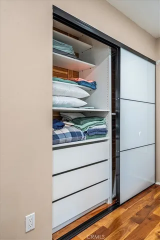 a bathroom with a shower sink vanity mirror and toilet