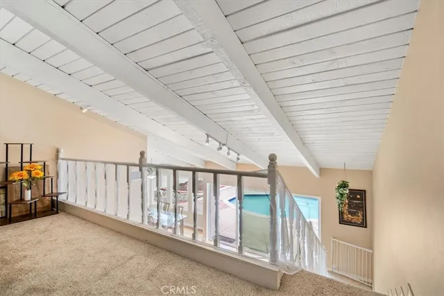 a view of a swimming pool with chairs