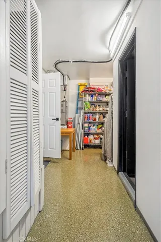 a room with furniture and pool table
