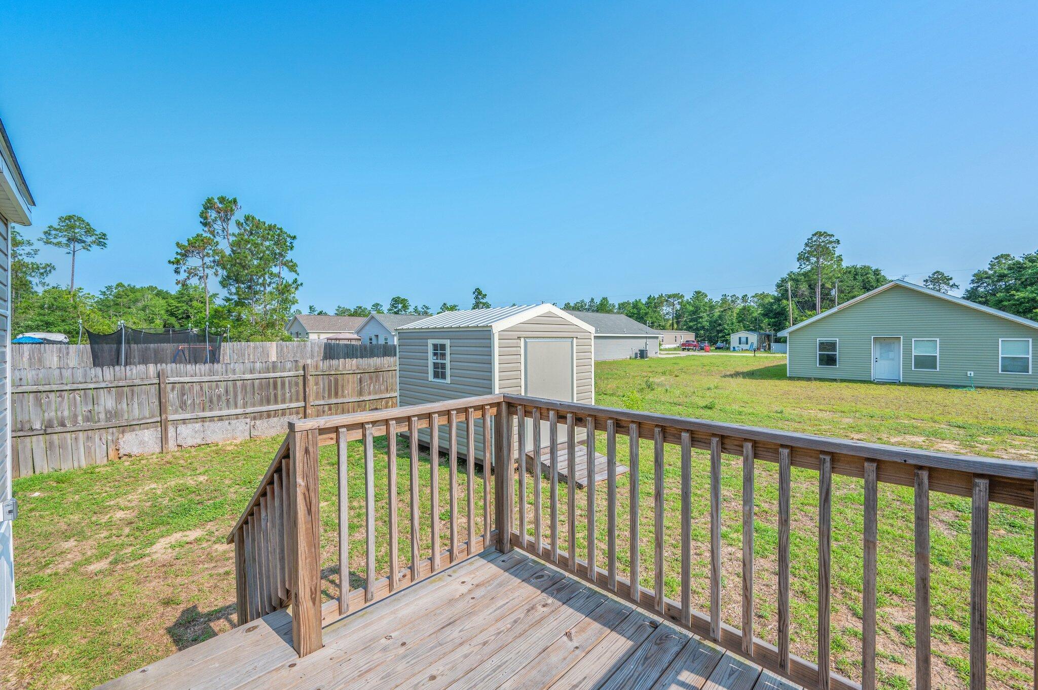 4625 Canary Way Crestview, FL 32539 - Photo 28 of 35 a view of a balcony with wooden floor