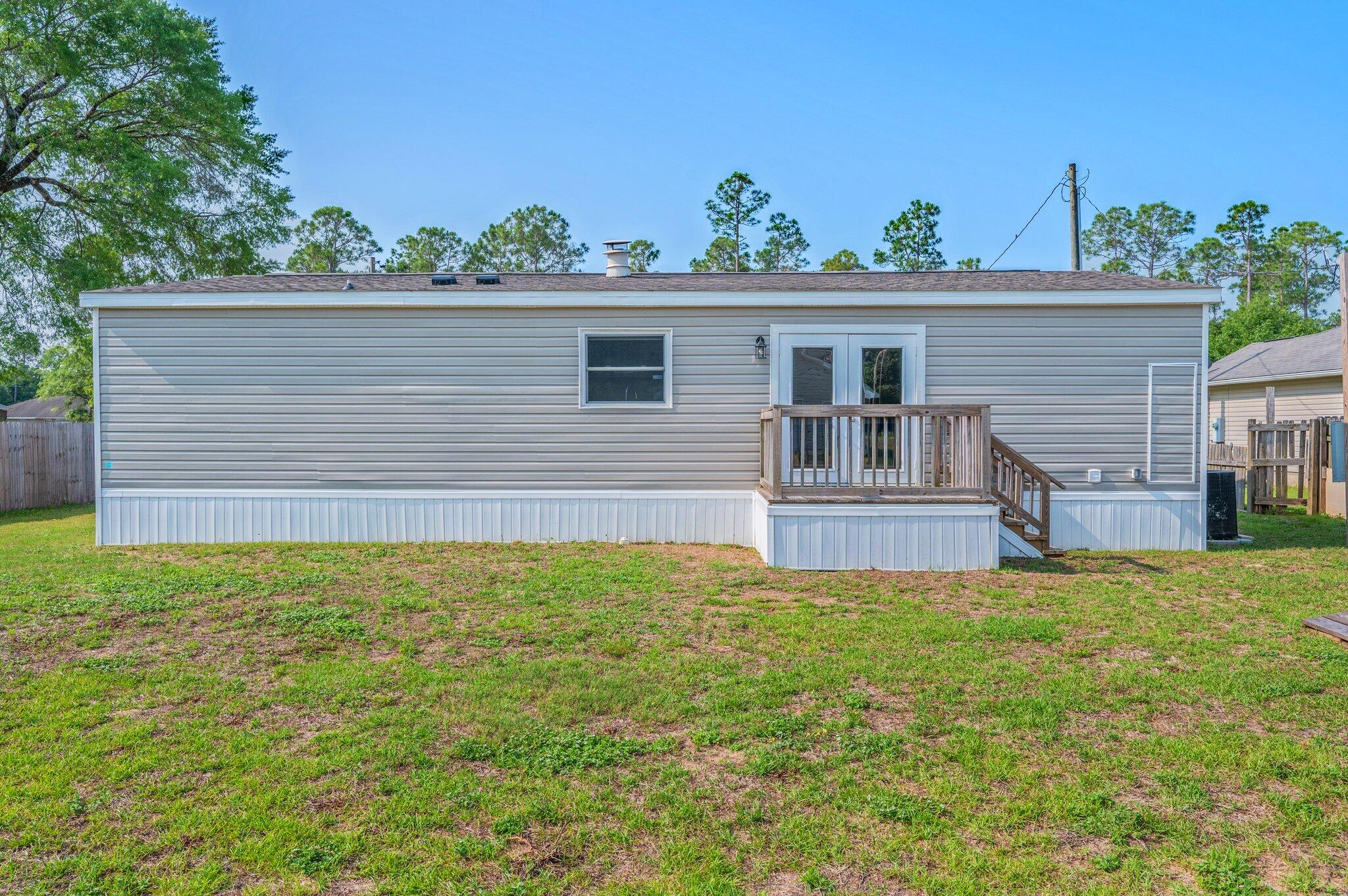 4625 Canary Way Crestview, FL 32539 - Photo 29 of 35 a view of a house with a yard