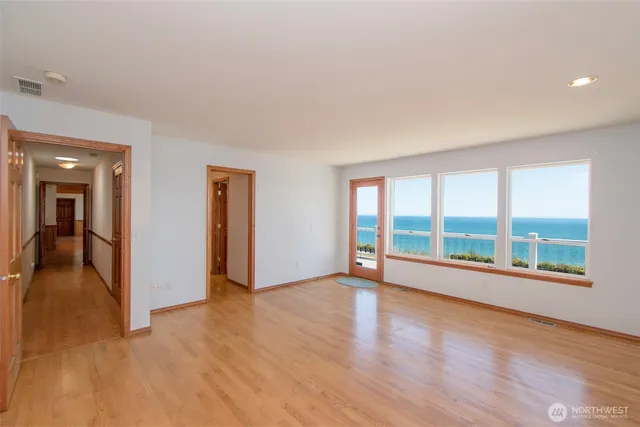 a bathroom with a granite countertop sink a toilet a mirror and vanity
