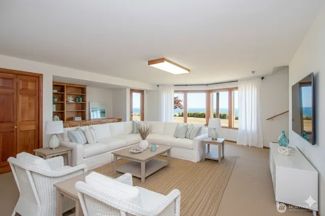 a view of a balcony with wooden floor and city view